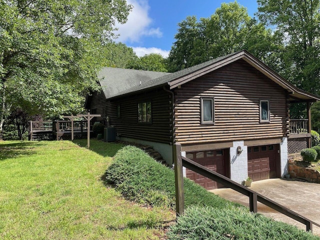 612 Peters Creek Dr, Stuart, VA 24171 - view of home's exterior featuring log siding, a garage, a yard, driveway, and a wooden deck