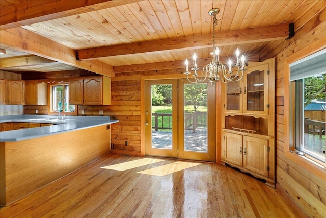 612 Peters Creek Dr, Stuart, VA 24171 - kitchen with a chandelier, wood walls, plenty of natural light, light wood-style floors, and a wooden ceiling with exposed beams