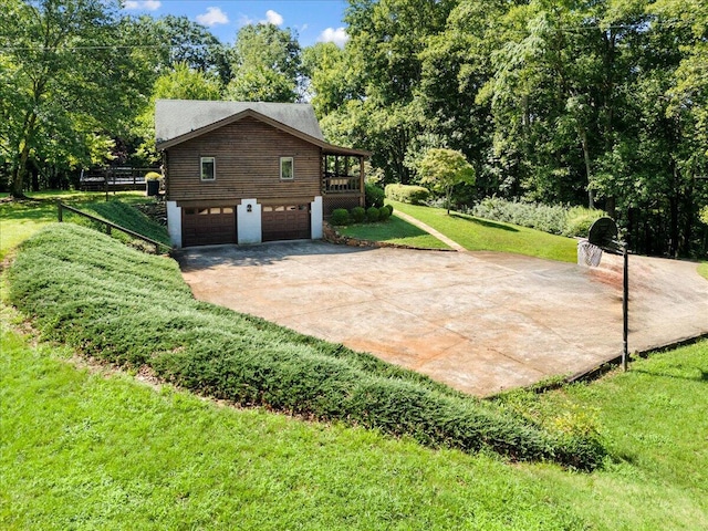 612 Peters Creek Dr, Stuart, VA 24171 - view of home's exterior with driveway, a yard, and a garage