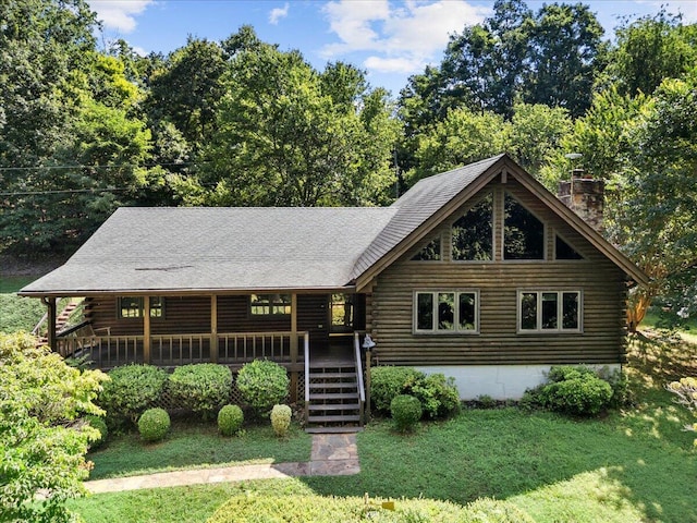612 Peters Creek Dr, Stuart, VA 24171 - cabin with log exterior, a chimney, a front yard, and stairway