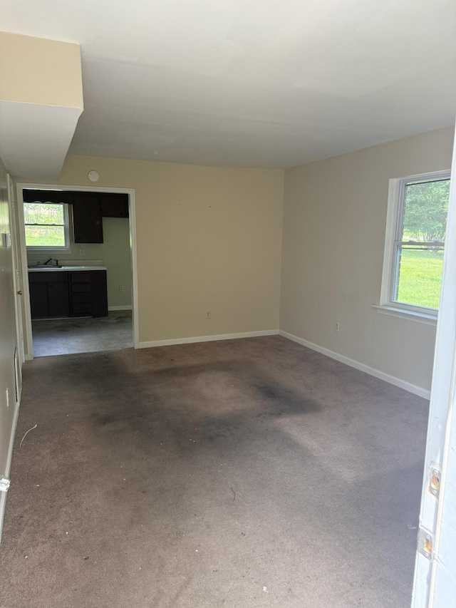 3107 Glenoak St SE, Roanoke, VA 24011 - empty room featuring healthy amount of natural light, baseboards, and carpet