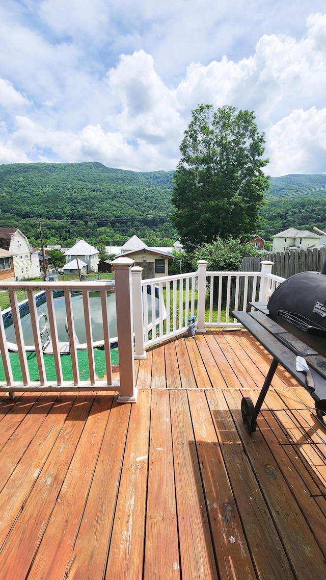 611 Alleghany St, Clifton Forge, VA 24422 - wooden terrace with a wooded view