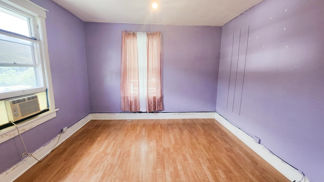 611 Alleghany St, Clifton Forge, VA 24422 - spare room featuring wood finished floors, baseboards, and cooling unit