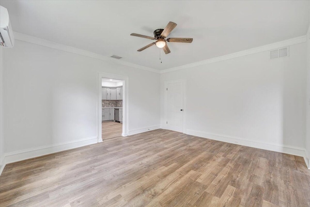 496 Boyd St, Buchanan, VA 24066 - empty room with a ceiling fan, light wood-type flooring, crown molding, and a wall unit AC