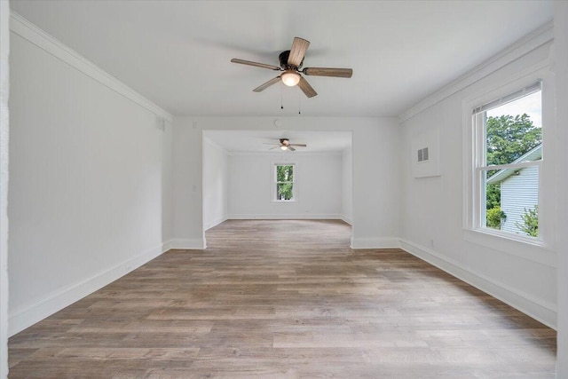 496 Boyd St, Buchanan, VA 24066 - unfurnished room featuring crown molding, a ceiling fan, and wood finished floors