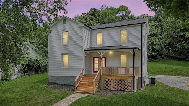 496 Boyd St, Buchanan, VA 24066 - traditional-style house with covered porch, stairway, a yard, and a shingled roof