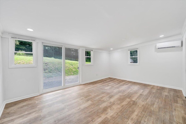 496 Boyd St, Buchanan, VA 24066 - spare room with a wall mounted air conditioner, wood finished floors, crown molding, and recessed lighting