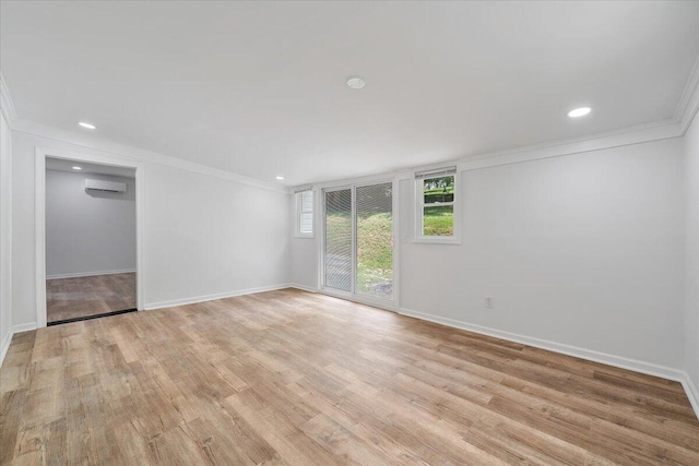 496 Boyd St, Buchanan, VA 24066 - unfurnished room featuring a wall mounted air conditioner, ornamental molding, light wood-style flooring, and recessed lighting