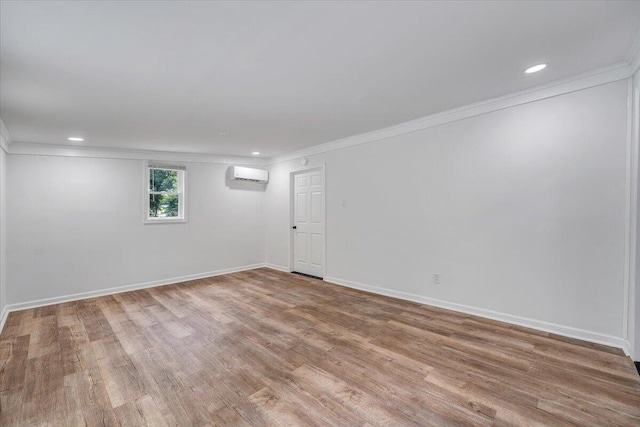 496 Boyd St, Buchanan, VA 24066 - spare room with a wall unit AC, ornamental molding, wood finished floors, and recessed lighting