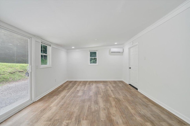 496 Boyd St, Buchanan, VA 24066 - unfurnished room with a wall unit AC, ornamental molding, light wood-type flooring, and recessed lighting