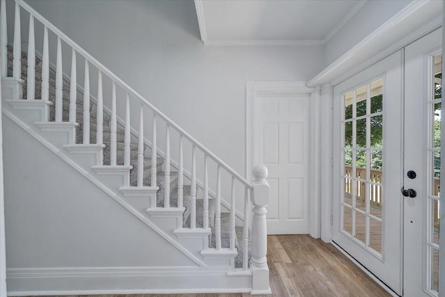 496 Boyd St, Buchanan, VA 24066 - foyer entrance with crown molding, wood finished floors, and stairs