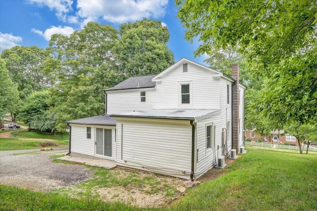 496 Boyd St, Buchanan, VA 24066 - back of property featuring a chimney and a lawn