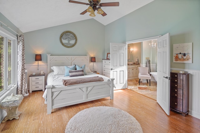 800 Long Island Dr, Moneta, VA 24121 - bedroom featuring high vaulted ceiling, light wood-type flooring, connected bathroom, wainscoting, and ceiling fan