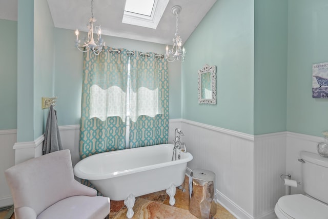 800 Long Island Dr, Moneta, VA 24121 - full bathroom featuring a chandelier, wainscoting, a skylight, a soaking tub, and vaulted ceiling