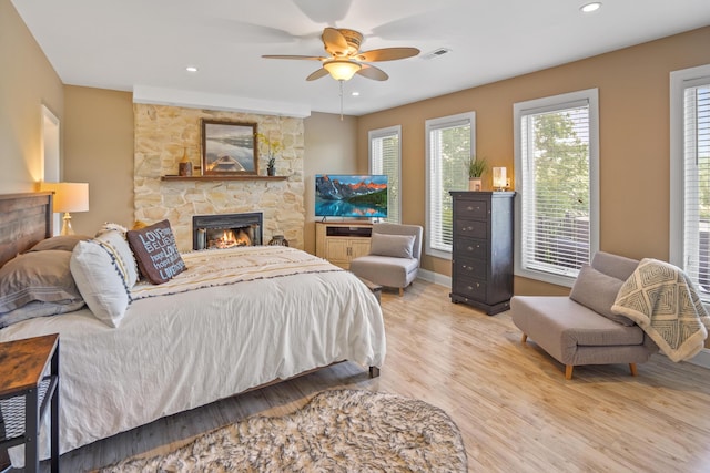 800 Long Island Dr, Moneta, VA 24121 - bedroom featuring wood finished floors, a fireplace, recessed lighting, and a ceiling fan
