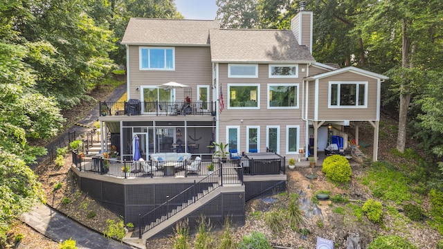 800 Long Island Dr, Moneta, VA 24121 - back of property with stairs, a chimney, a deck, and a sunroom