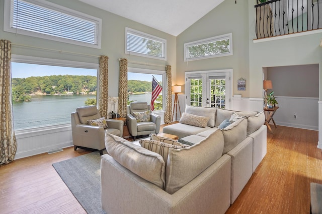 800 Long Island Dr, Moneta, VA 24121 - living room with high vaulted ceiling, wood finished floors, wainscoting, french doors, and a water view