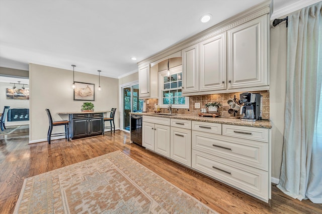 134 Sawyer Dr, Salem, VA 24153 - kitchen with tasteful backsplash, wood finished floors, dishwasher, ornamental molding, and decorative light fixtures