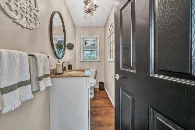 134 Sawyer Dr, Salem, VA 24153 - bathroom featuring wood finished floors, vanity, and a chandelier