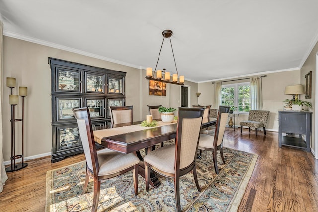 134 Sawyer Dr, Salem, VA 24153 - dining room featuring wood finished floors, ornamental molding, and a chandelier