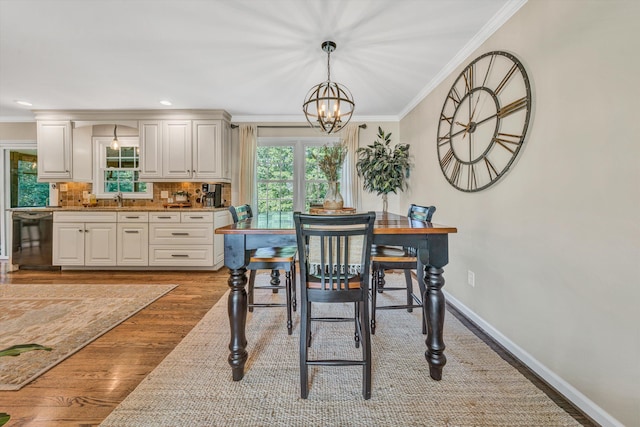 134 Sawyer Dr, Salem, VA 24153 - dining space with ornamental molding, a chandelier, and wood finished floors