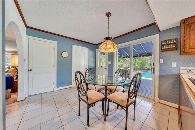 5880 Sugar Loaf Mountain Rd, Roanoke, VA 24018 - dining room featuring crown molding, a textured ceiling, arched walkways, and light tile patterned floors