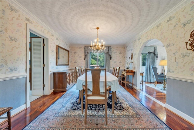 5880 Sugar Loaf Mountain Rd, Roanoke, VA 24018 - dining area featuring hardwood / wood-style floors, arched walkways, wallpapered walls, a chandelier, and ornamental molding