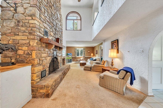 5880 Sugar Loaf Mountain Rd, Roanoke, VA 24018 - living area with a fireplace, a towering ceiling, tile patterned flooring, and arched walkways
