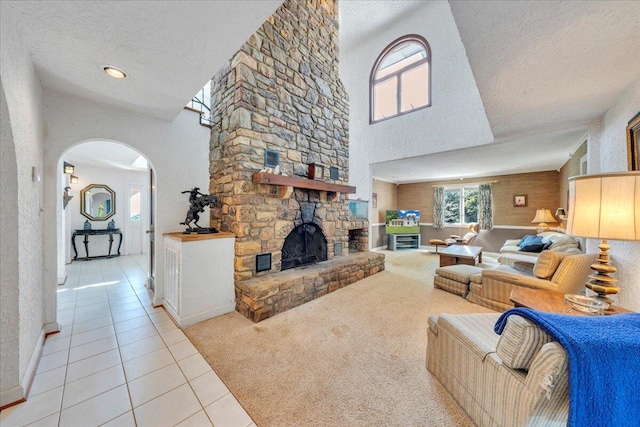 5880 Sugar Loaf Mountain Rd, Roanoke, VA 24018 - living area with light tile patterned flooring, a textured ceiling, healthy amount of natural light, arched walkways, and a towering ceiling