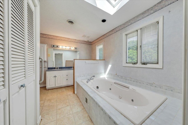 5880 Sugar Loaf Mountain Rd, Roanoke, VA 24018 - bathroom with vanity, a tub with jets, a skylight, and a closet