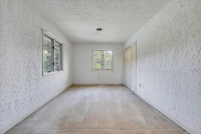 5880 Sugar Loaf Mountain Rd, Roanoke, VA 24018 - empty room featuring a textured ceiling, light carpet, and a textured wall