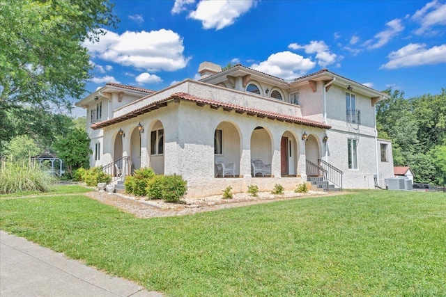 5880 Sugar Loaf Mountain Rd, Roanoke, VA 24018 - mediterranean / spanish house with stucco siding, a front yard, covered porch, and a chimney