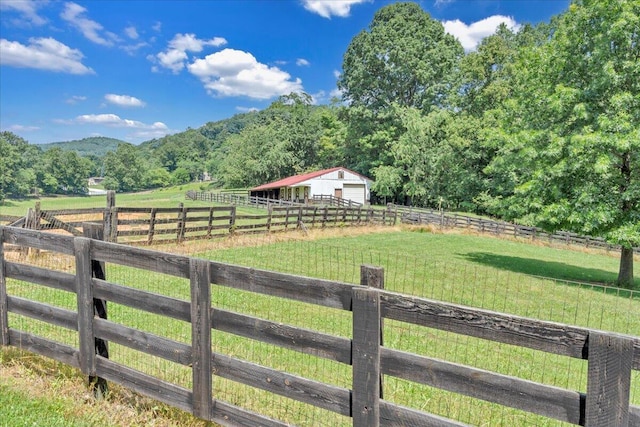 5880 Sugar Loaf Mountain Rd, Roanoke, VA 24018 - view of yard featuring a rural view, a detached garage, an outbuilding, and a wooded view