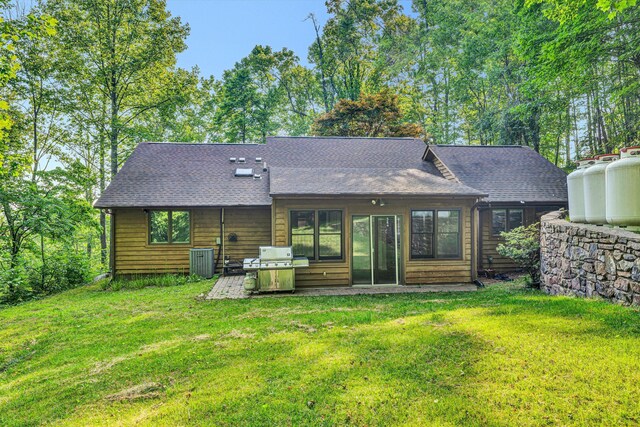 8757 Bent Mountain Rd, Roanoke, VA 24018 - back of house featuring a lawn and roof with shingles