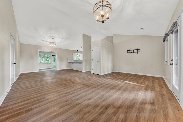 8757 Bent Mountain Rd, Roanoke, VA 24018 - unfurnished living room featuring a chandelier, wood finished floors, and lofted ceiling