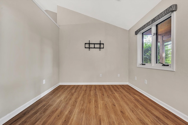 8757 Bent Mountain Rd, Roanoke, VA 24018 - spare room featuring vaulted ceiling and wood finished floors