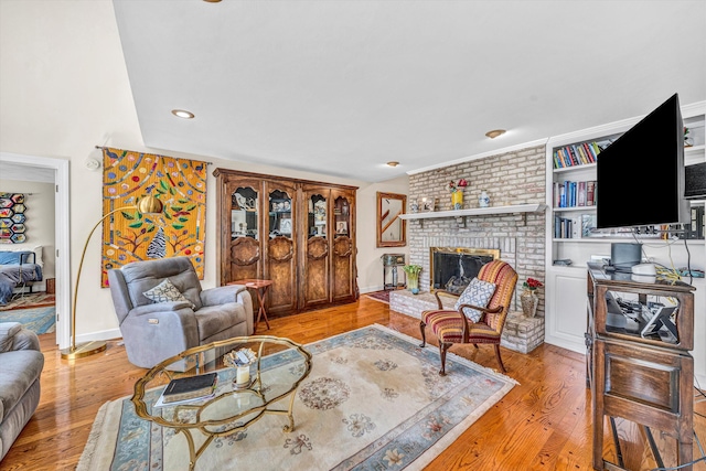 30 Island Green Cir Unit 22, Penhook, VA 24137 - living area featuring light wood-type flooring, a brick fireplace, and recessed lighting