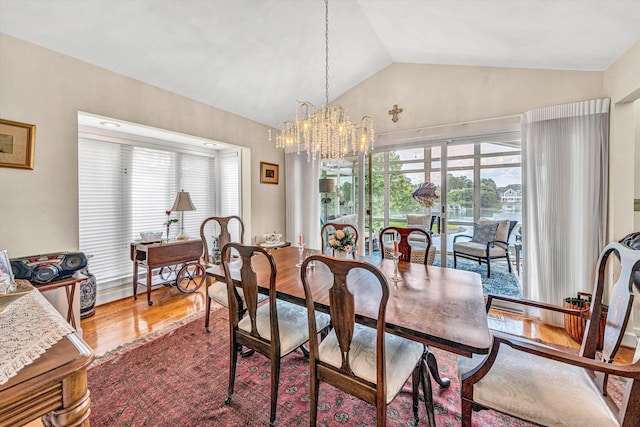 30 Island Green Cir Unit 22, Penhook, VA 24137 - dining space with vaulted ceiling, healthy amount of natural light, a chandelier, and wood finished floors