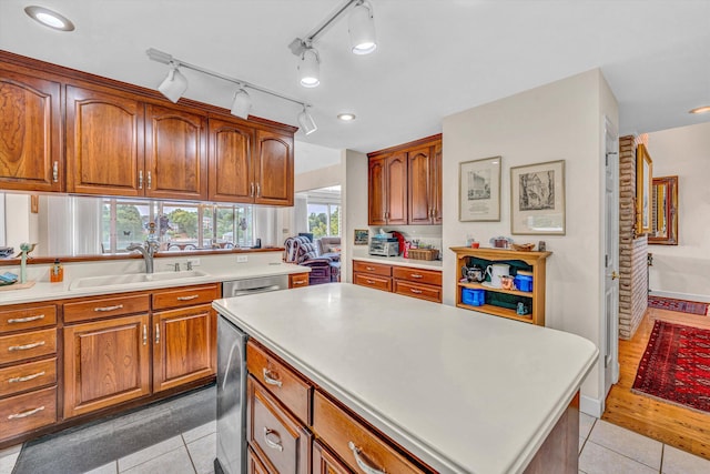 30 Island Green Cir Unit 22, Penhook, VA 24137 - kitchen with light tile patterned flooring, brown cabinetry, light countertops, and a kitchen island