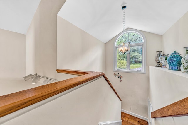 30 Island Green Cir Unit 22, Penhook, VA 24137 - stairway featuring lofted ceiling, a chandelier, and wood finished floors