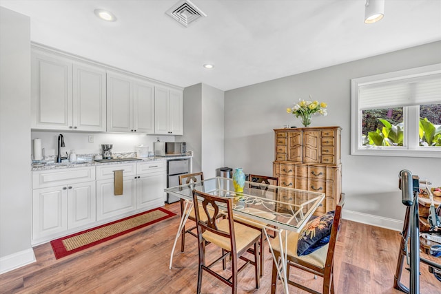 30 Island Green Cir Unit 22, Penhook, VA 24137 - dining room with light wood-style flooring, recessed lighting, and wet bar