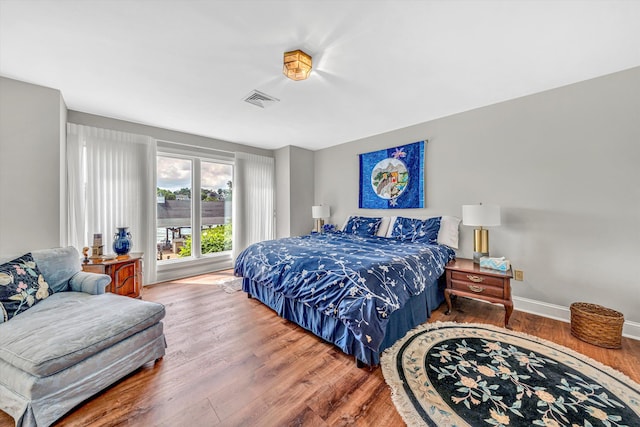 30 Island Green Cir Unit 22, Penhook, VA 24137 - bedroom featuring wood finished floors and baseboards