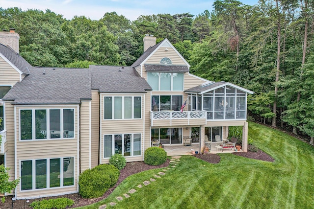 30 Island Green Cir Unit 22, Penhook, VA 24137 - rear view of house with a patio, a sunroom, a lawn, a chimney, and roof with shingles
