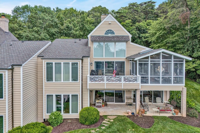 30 Island Green Cir Unit 22, Penhook, VA 24137 - back of property featuring a patio area, a sunroom, roof with shingles, and a chimney