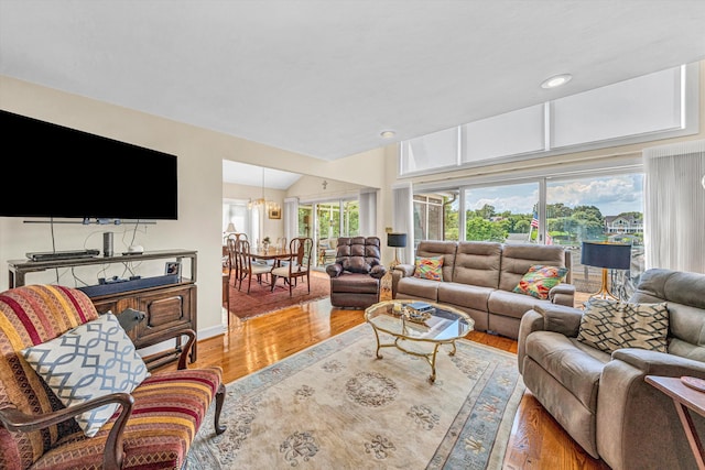 30 Island Green Cir Unit 22, Penhook, VA 24137 - living area with wood finished floors, a chandelier, lofted ceiling, and recessed lighting