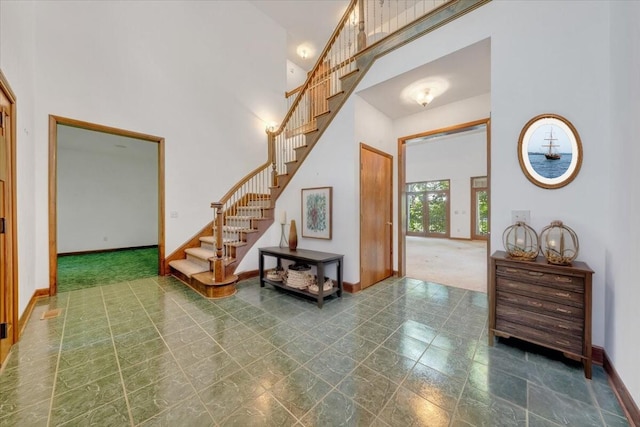 723 Fox Chase Rd, Wirtz, VA 24184 - tiled entryway featuring a high ceiling and stairway