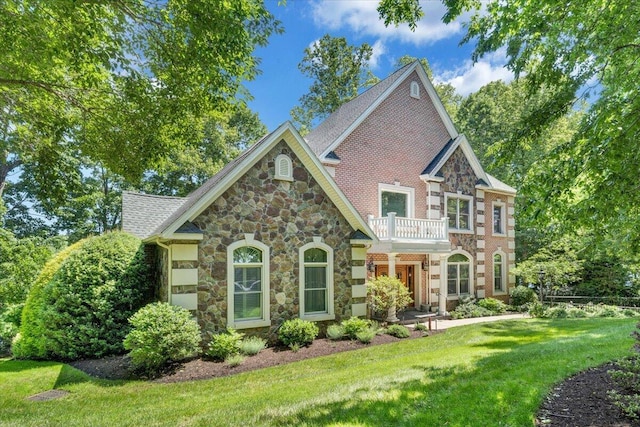 723 Fox Chase Rd, Wirtz, VA 24184 - back of property featuring stone siding, a yard, and a balcony