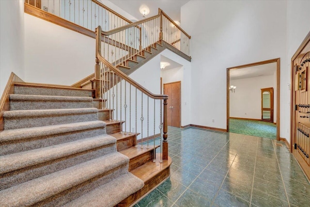 723 Fox Chase Rd, Wirtz, VA 24184 - stairs with a high ceiling and a chandelier