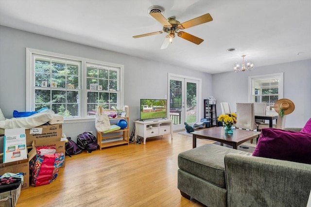 139 Owens Dr, Ferrum, VA 24088 - living area featuring a chandelier, healthy amount of natural light, and light wood finished floors