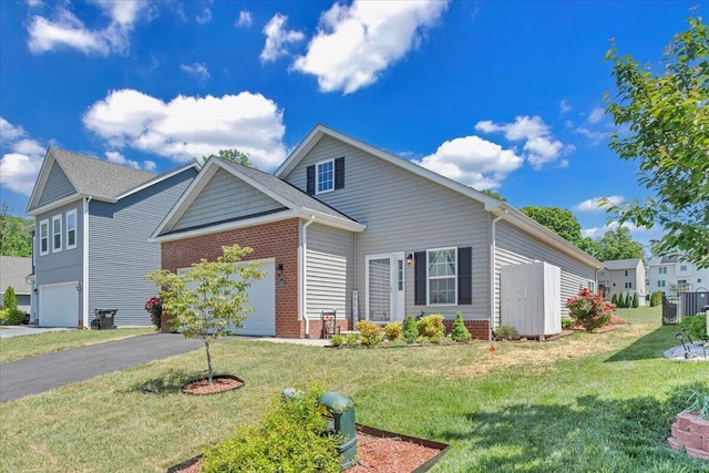 8355 Leighburn Dr, Roanoke, VA 24019 - traditional-style home with brick siding, driveway, a front lawn, and a garage